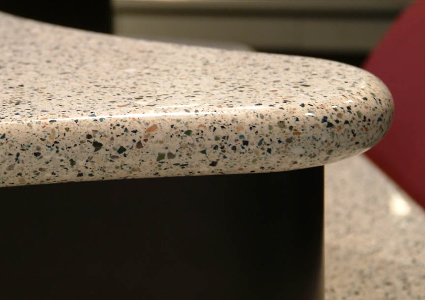 Premium Corian surface detail — podcast desk